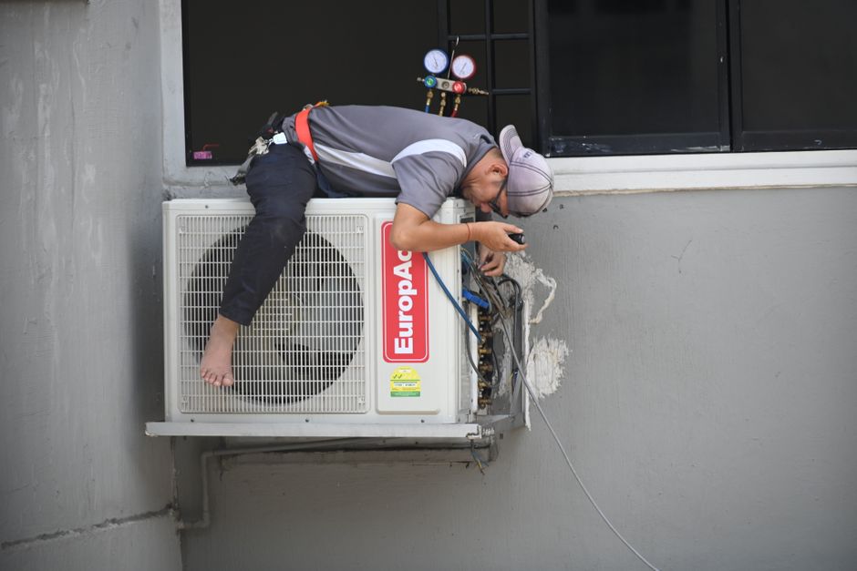 Friendly HVAC technician providing expert heating and cooling service